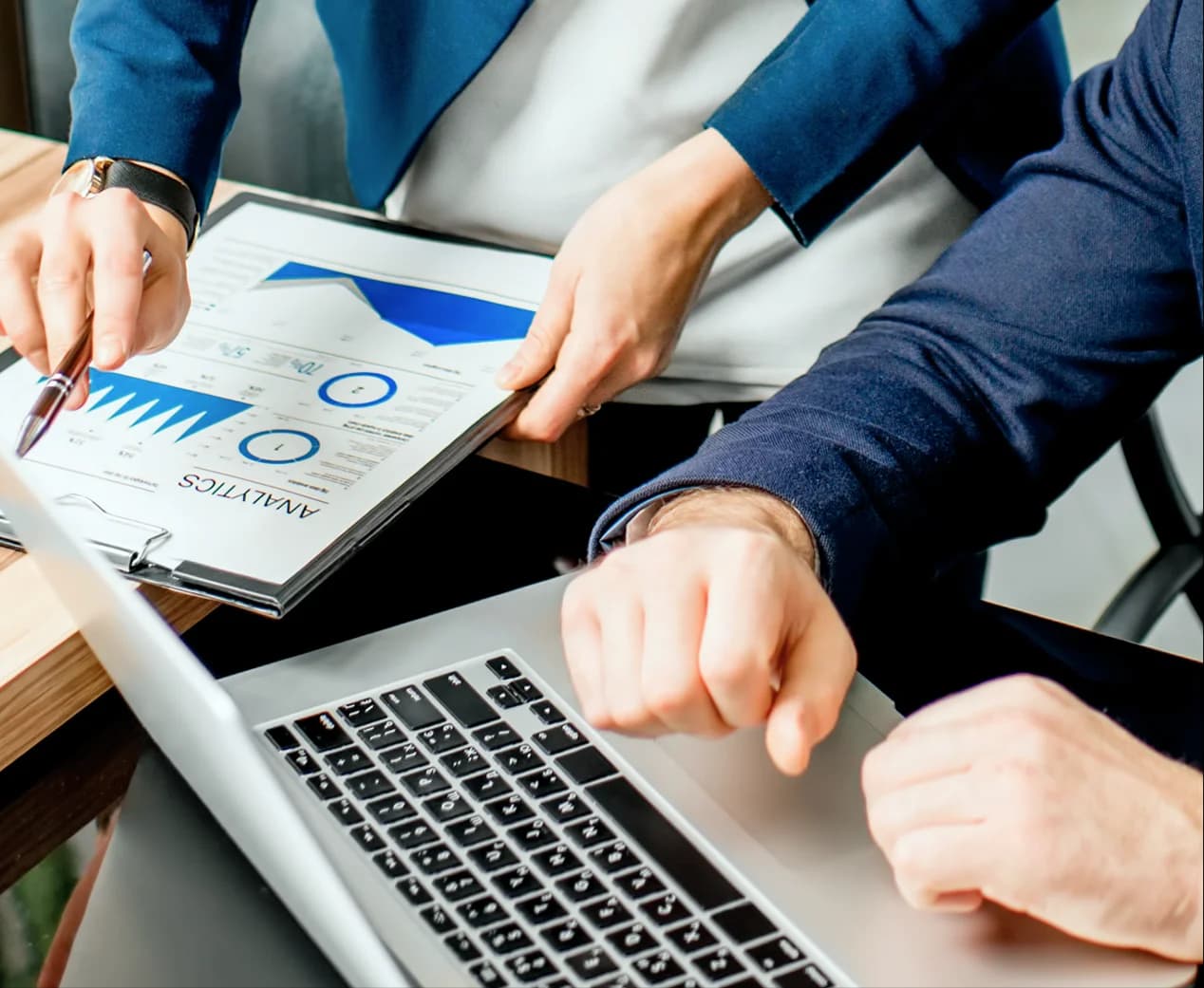 Financial advisor reviewing an analytics report with a client